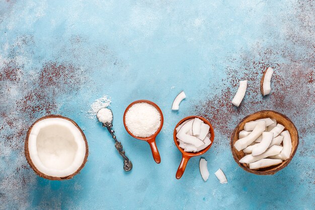 Whole coconut and various pieces of coconut