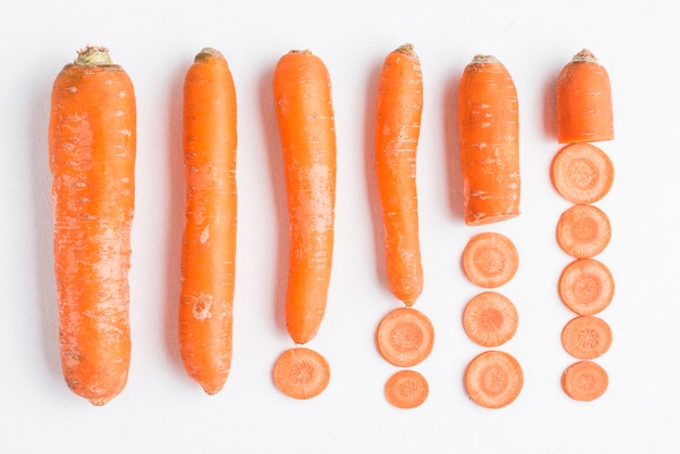 Whole and sliced carrots