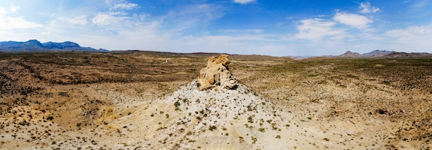 Free photo wide-angle shot of the sandy valley with a rock in the middle