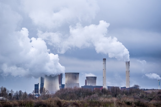 Free photo wide angle shot of white smoke coming out of the nuclear plants