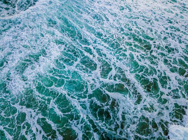 Wide shot of blue ocean waves