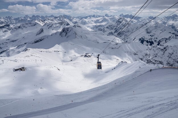 Wide shot of a cable cart in a snowy mountain