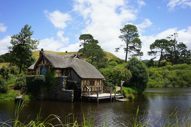 Free photo wide shot of the hobbiton movie set in matamata new zealand