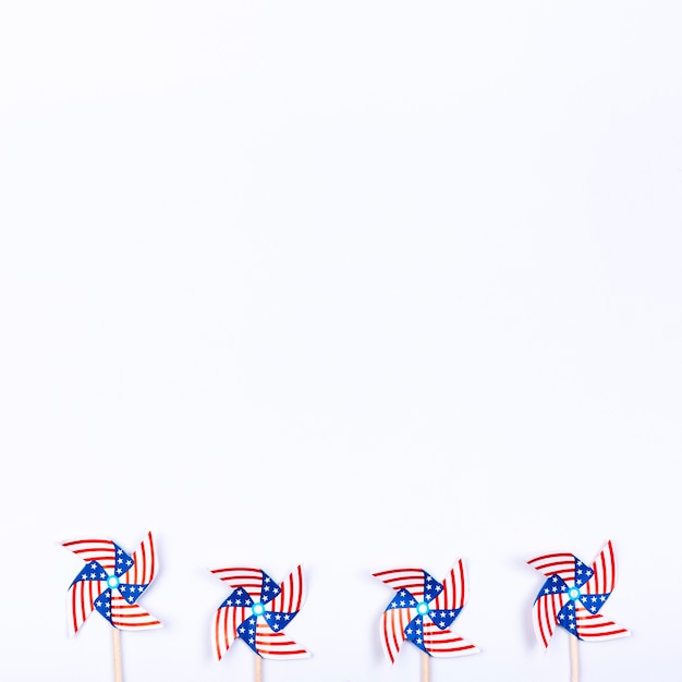 Free photo wind spinners with symbol of american flag placed in row