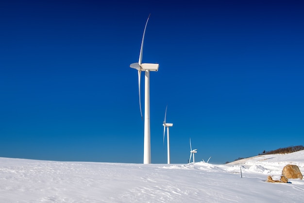 Free Photo wind turbine and blue sky in winter landscape