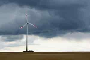 Free photo windmill in a field