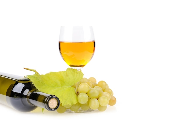 Wine bottle, glass and grapes isolated on white