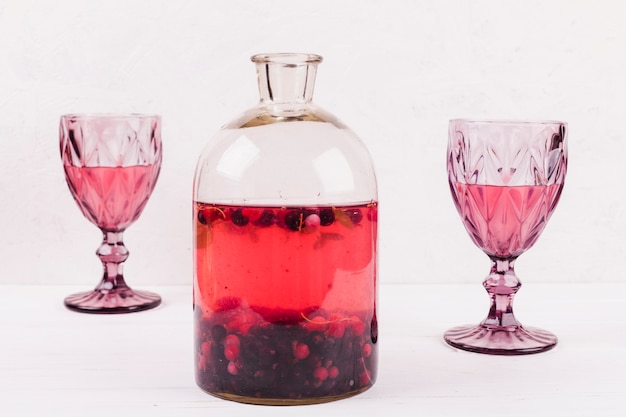 Free photo wine glasses with drink and compote