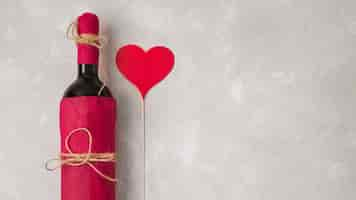 Free photo wine with heart sign and copy space