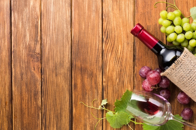 Wine with red and green grapes frame