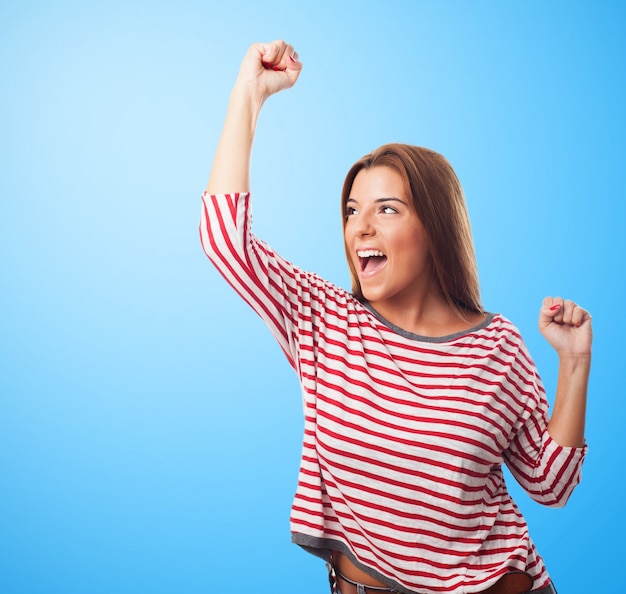 winning cheerful model woman celebrating