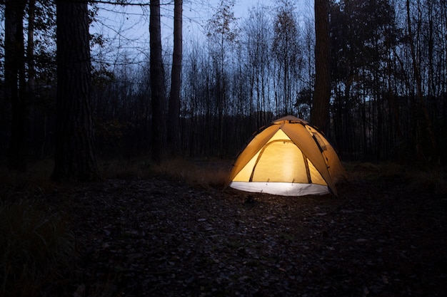 Winter camping landscape with tent