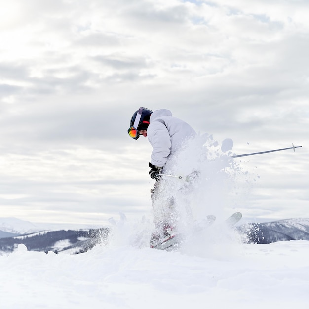 Winter kinds of sport Skier doing tricks in the mountains in winter season