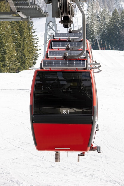 Winter scenery of a ropeway surrounded by the snowy mountains