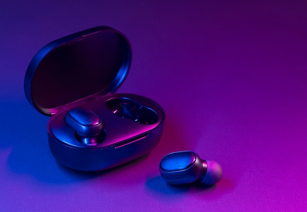 Free Photo wireless earbuds with neon cyberpunk style lighting