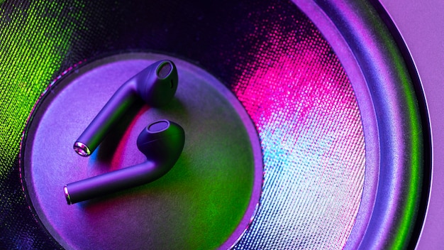 Wireless earbuds with neon cyberpunk style lighting