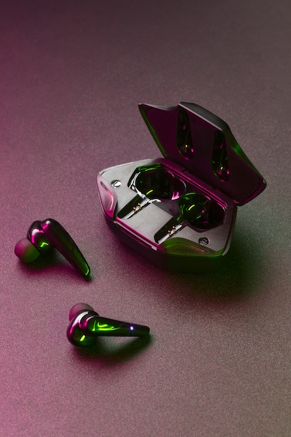 Wireless earbuds with neon cyberpunk style lighting