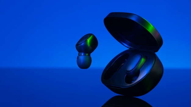 Free Photo wireless earbuds with neon cyberpunk style lighting