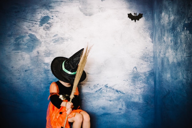 Free photo witch girl in halloween costume