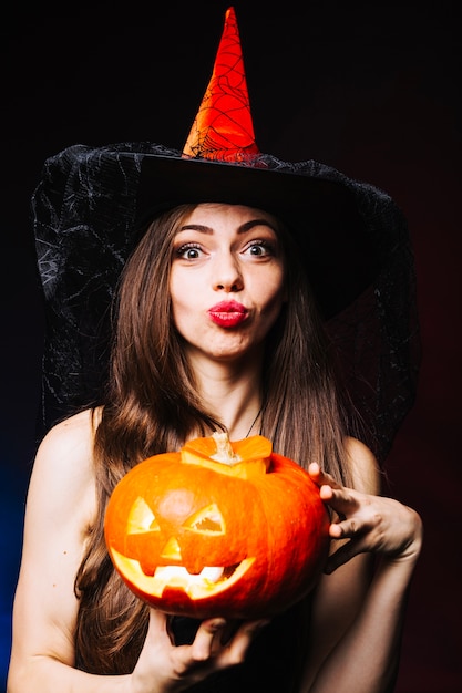 Free Photo witch girl with pumpkin