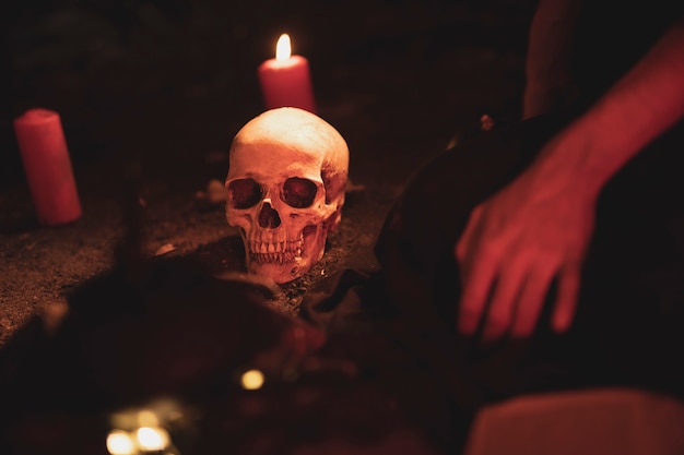 Free Photo witchcraft arrangement with skull and candles