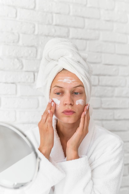 Woman applying homemade remedy