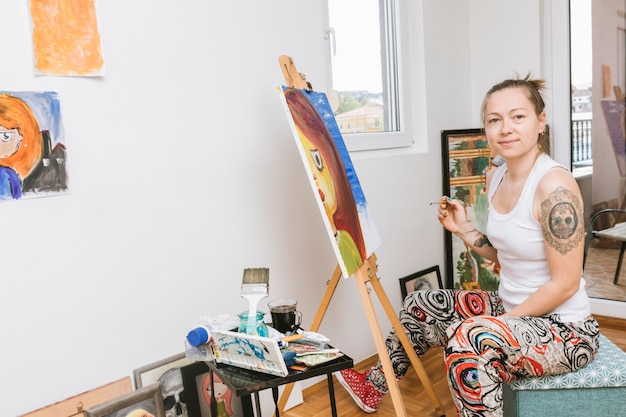 Woman artist working in studio