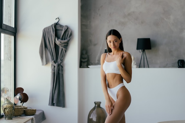 Woman In Bathroom. Fashion portrait model in bath.