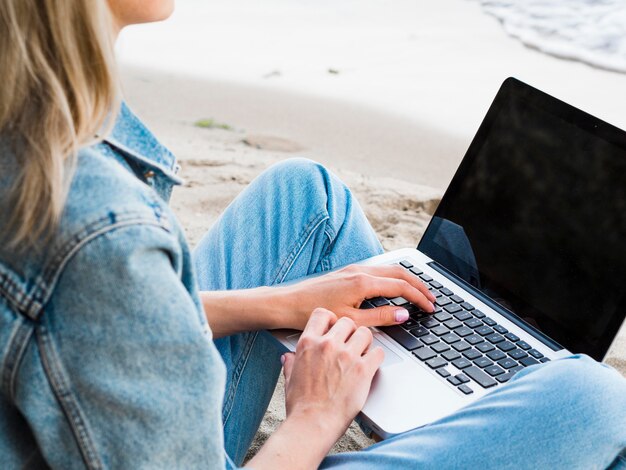 Woman at the beach working