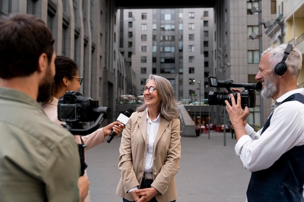 Woman being interviewed outdoors