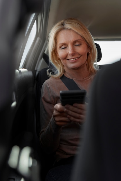 Free photo woman being a passenger in a car during driver's license test