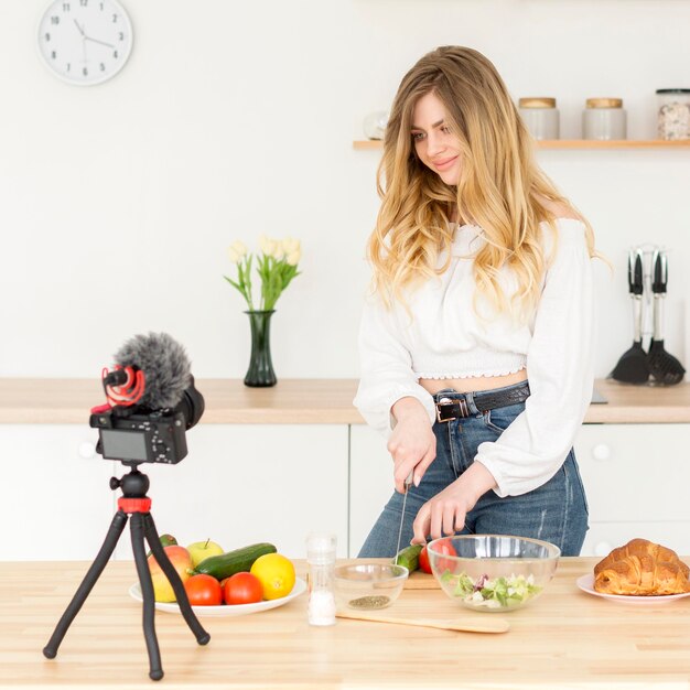 Woman blogger cooking at home