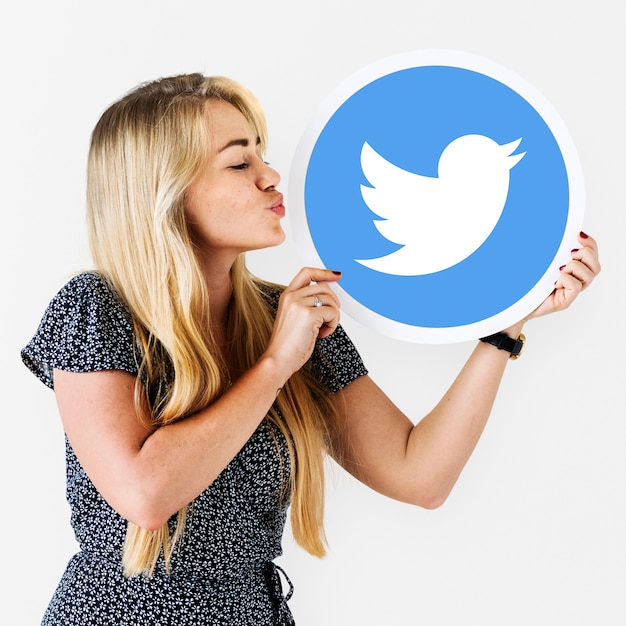 Woman blowing a kiss to a Twitter icon