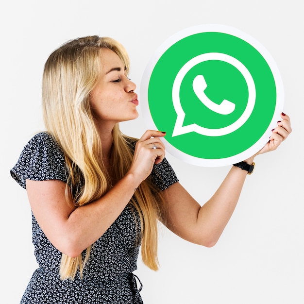 Free photo woman blowing a kiss to a whatsapp messenger icon