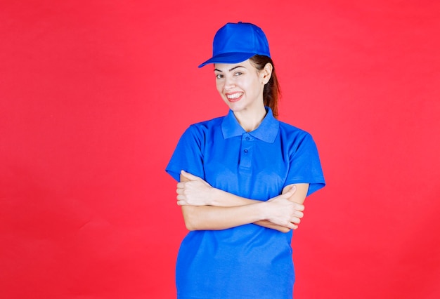 Free Photo woman in blue uniform giving positive and neutral poses. 