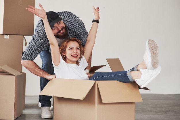 Woman in the bo feels good. Happy couple together in their new house. Conception of moving