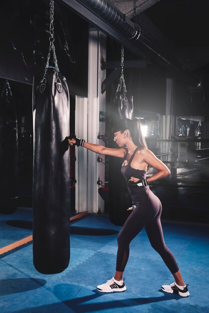 Woman boxing in gym