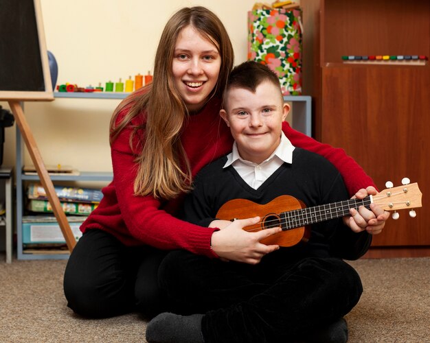 Woman and boy with down syndrome posing