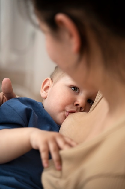 Woman breast feeding her child