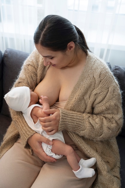 Woman breast feeding her child