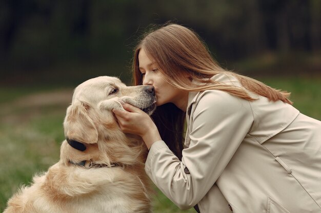 Woman in a brown coat. Lady with a labrador