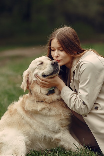 Woman in a brown coat. Lady with a labrador