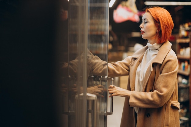 Woman buying products at grocery store