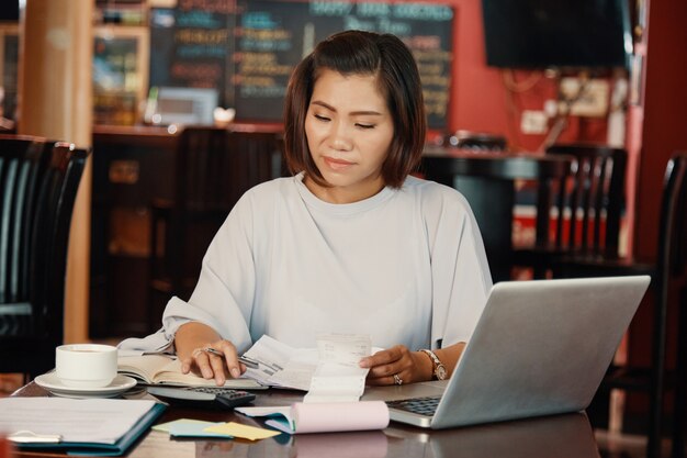 woman calculating expenses