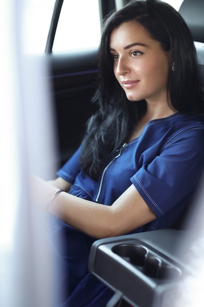 Free photo woman in a car