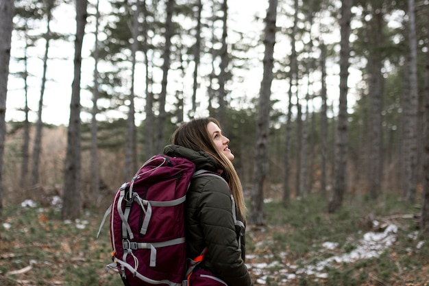 Free photo woman carrying backpack medium shot