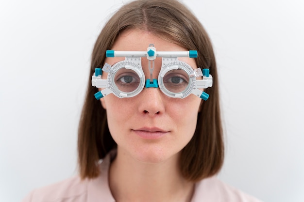 Woman checking her diopters with a special equipment for lenses