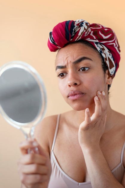 Woman checking her face close up