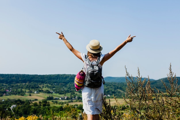 Woman cheering a beautiful day outside