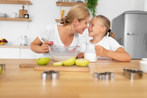 Woman and child cooking medium shot